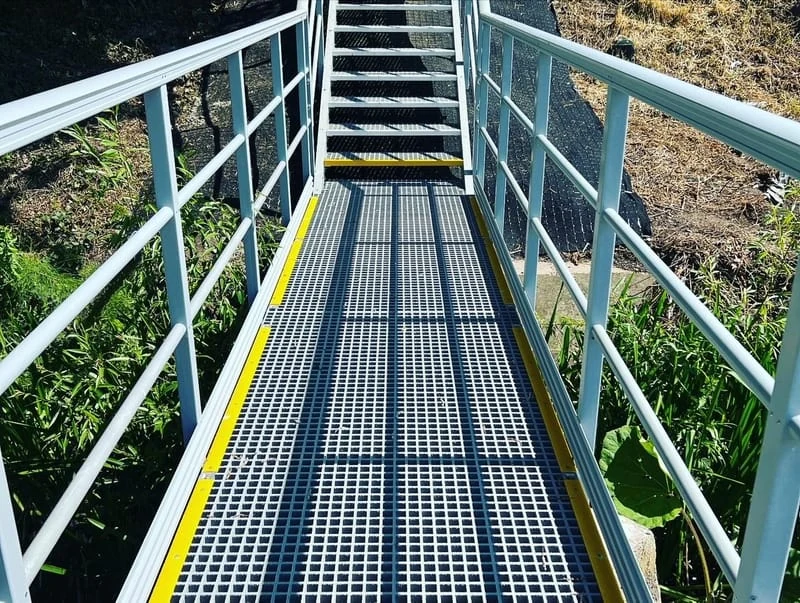 GRP access platform with grating and handrails